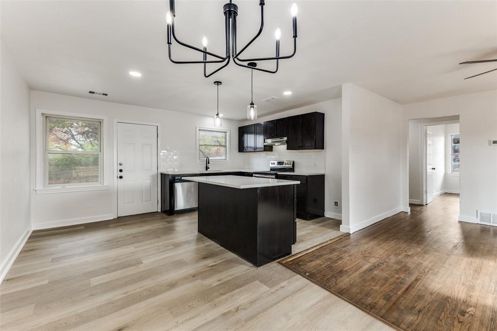 2723 Gus Thomasson Road Dallas, TX 75228 - Photo 7 of 26 a view of kitchen with microwave and window