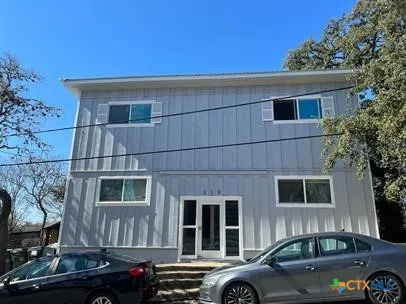 a front view of a house with parking