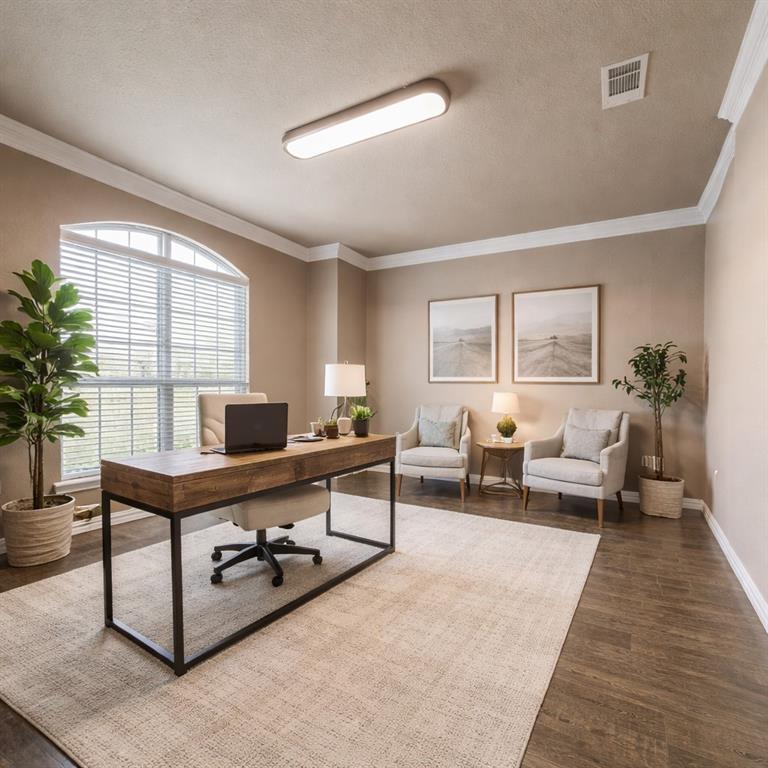 a living room with furniture large window and a table