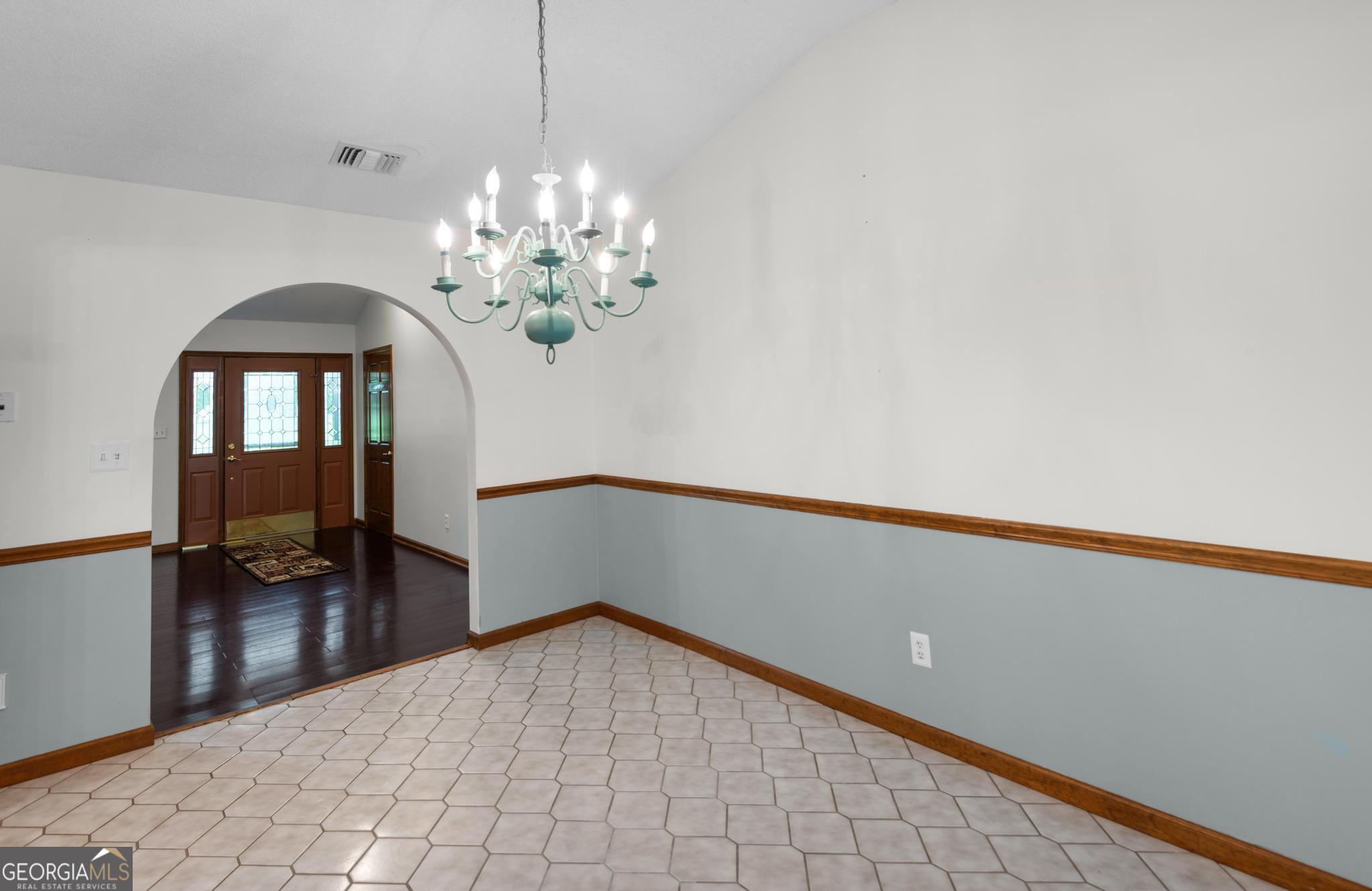 4909 Perry Road Claxton, GA 30417 - Photo 17 of 53 a view of a livingroom with a chandelier furniture and windows