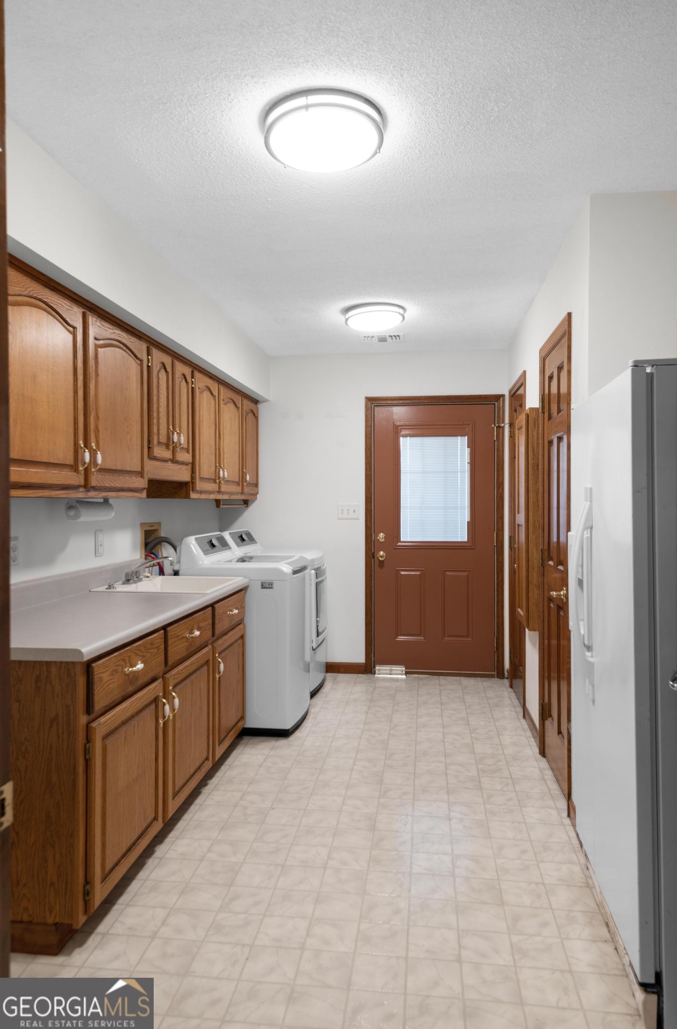 4909 Perry Road Claxton, GA 30417 - Photo 22 of 53 a kitchen with stainless steel appliances granite countertop a refrigerator and a stove top oven