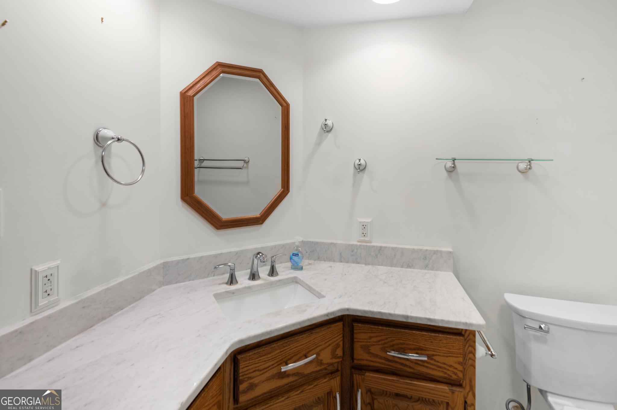 4909 Perry Road Claxton, GA 30417 - Photo 26 of 53 a bathroom with a sink and a mirror