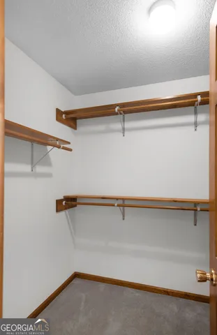 a bathroom with a granite countertop sink a toilet and bathtub