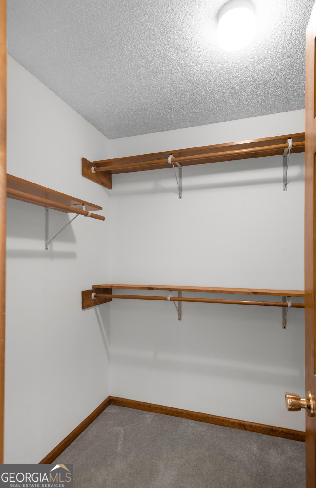 4909 Perry Road Claxton, GA 30417 - Photo 32 of 53 a view of a room with racks on the wall