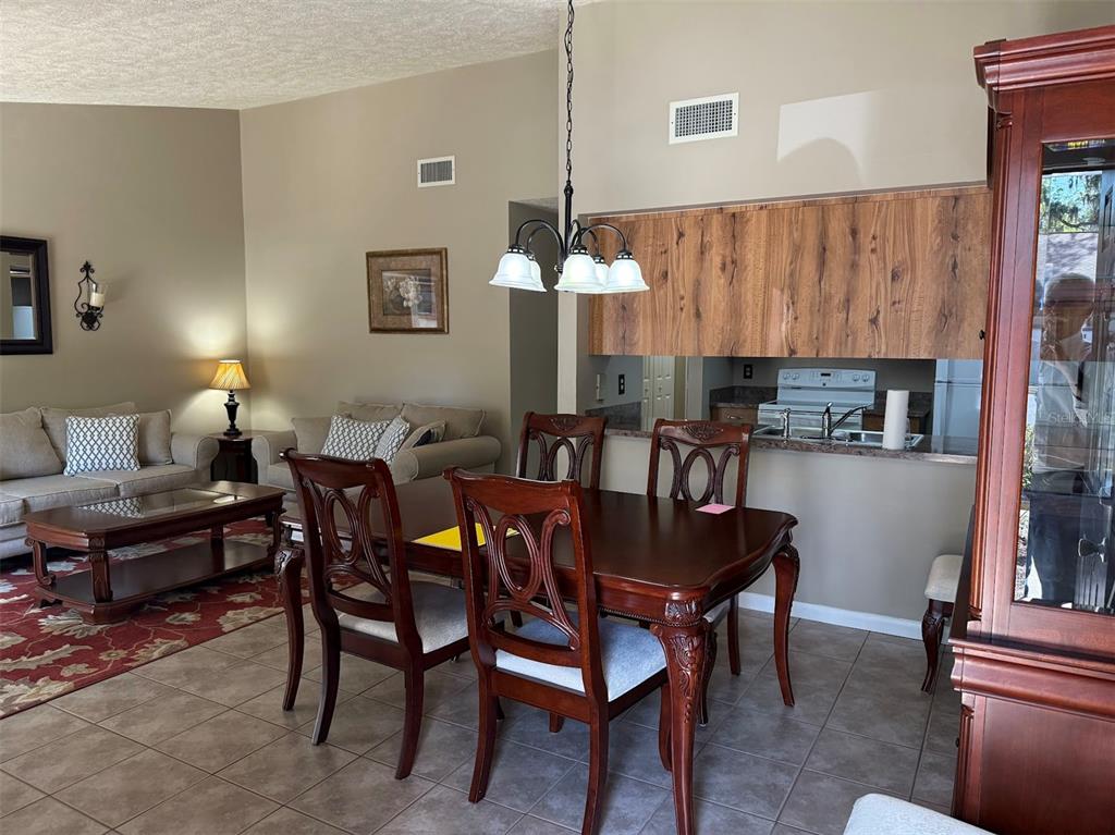 3021 Southeast 5th Terrace, Unit A Ocala, FL 34471 - Photo 3 of 13 a view of a dining room with furniture