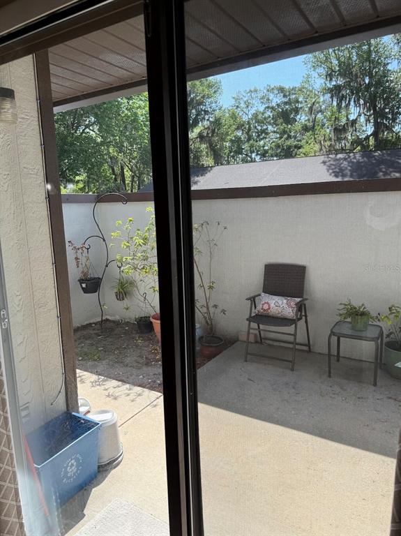 3021 Southeast 5th Terrace, Unit A Ocala, FL 34471 - Photo 6 of 13 a view of living room with furniture and a floor to ceiling window
