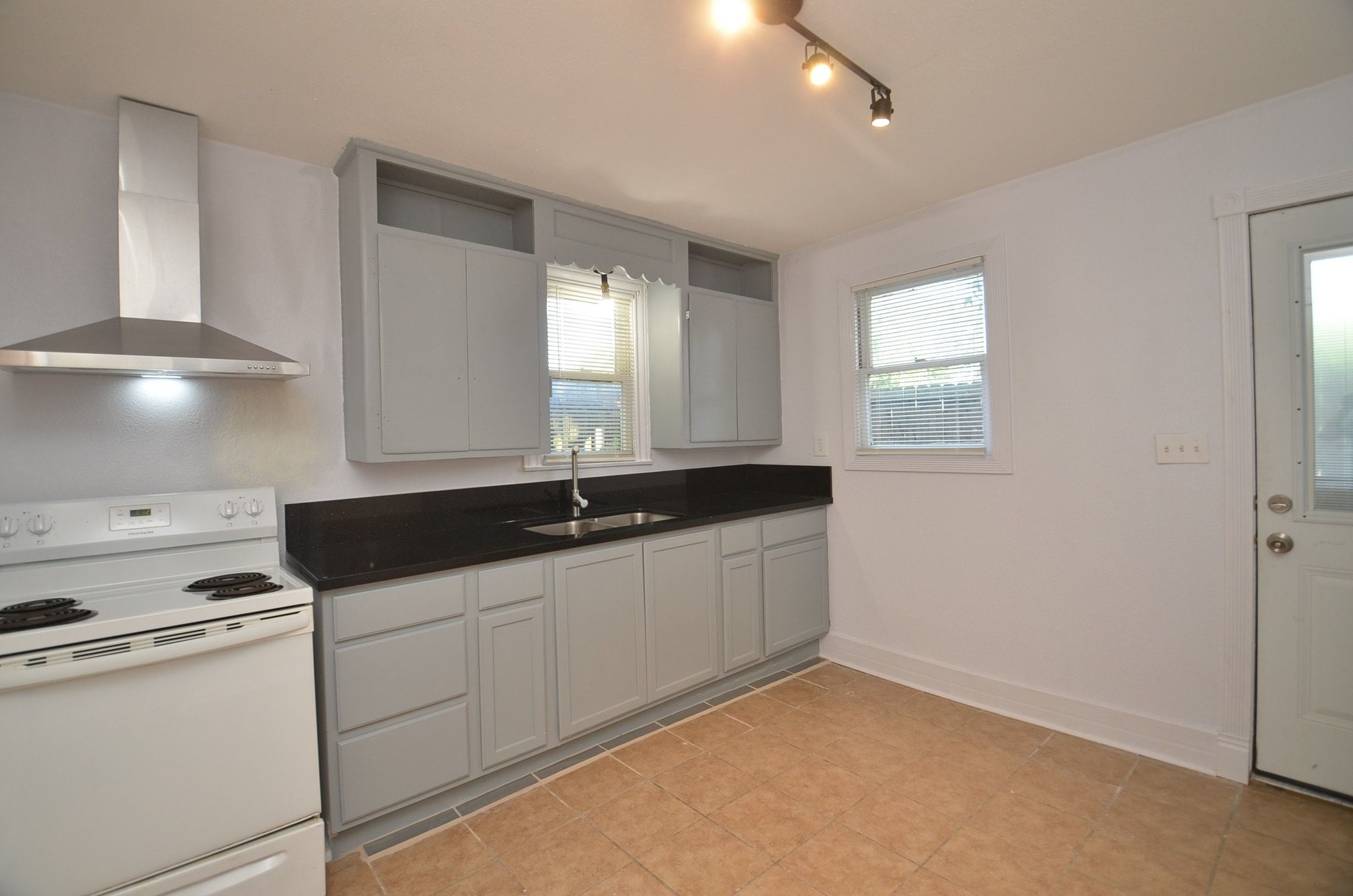 1600 5th Street Rosenberg, TX 77471 - Photo 9 of 24 Functional kitchen with ample cabinet storage.