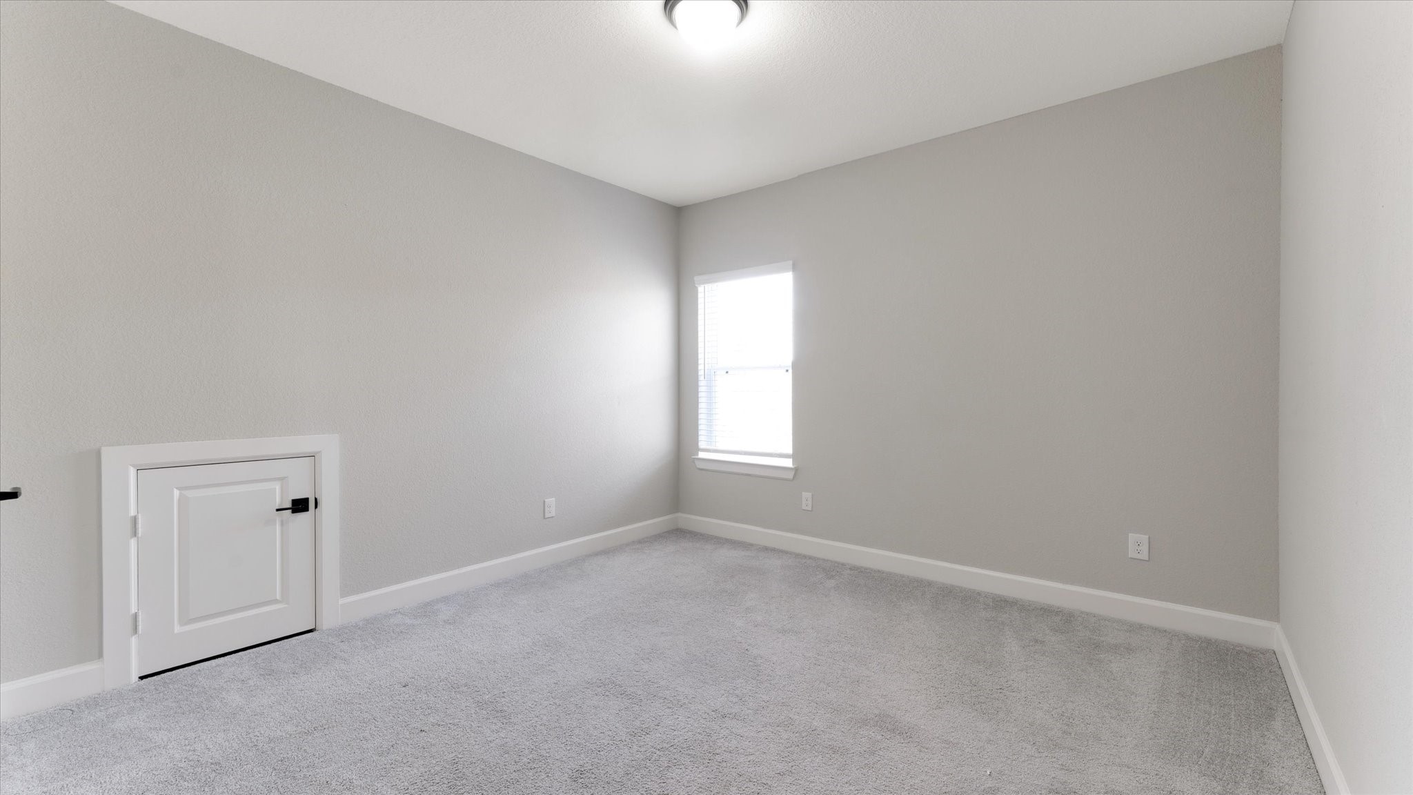 15607 Rising Wren Court Conroe, TX 77302 - Photo 34 of 40 an empty room with windows and entrance