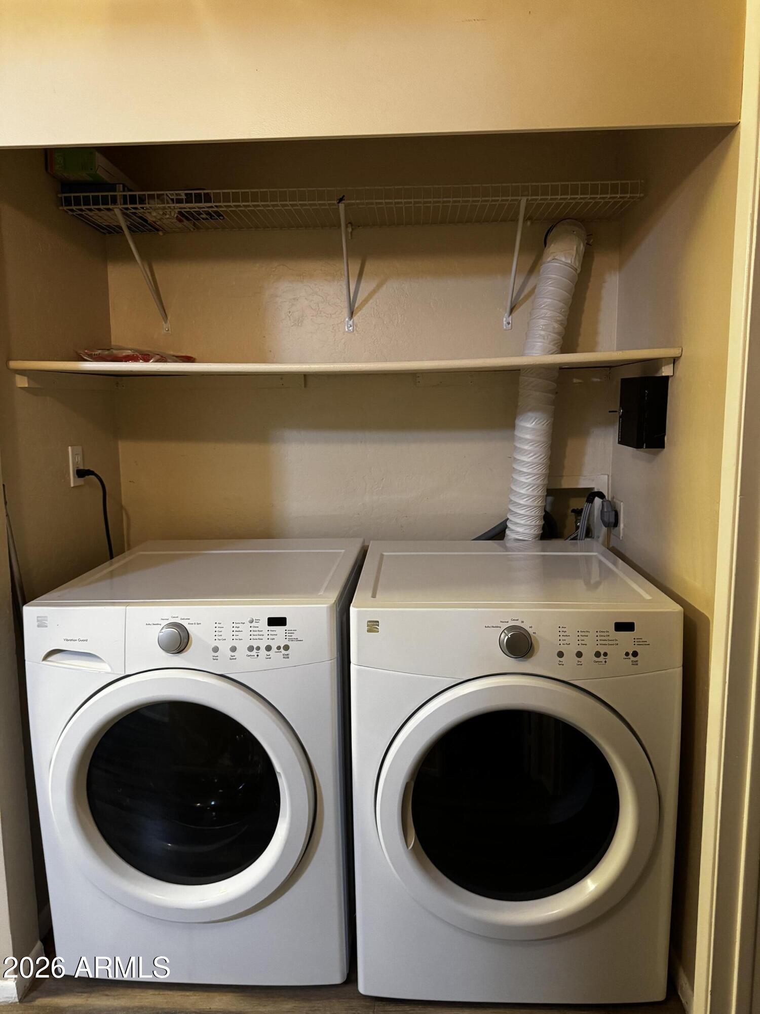 12123 West Bell Road, Unit 258 Surprise, AZ 85378 - Photo 9 of 30 a utility room with dryer and washer