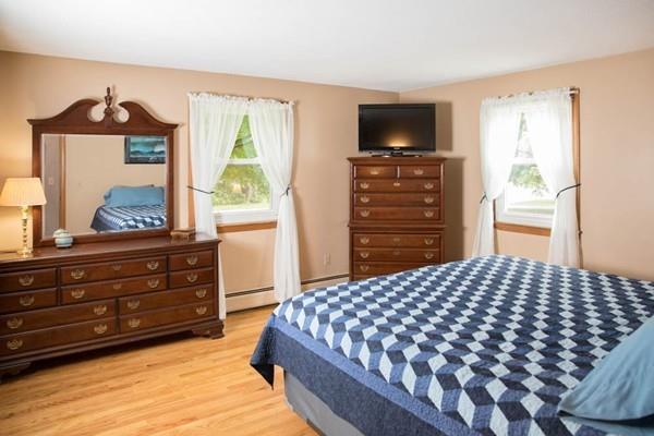 25 Fairview Road Wilbraham, MA 01095 - Photo 12 of 32 a bedroom with a bed and a flat tv screen on dresser