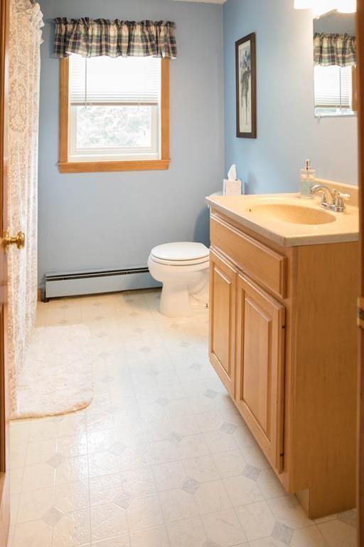 25 Fairview Road Wilbraham, MA 01095 - Photo 15 of 32 a bathroom with a sink a toilet and a window