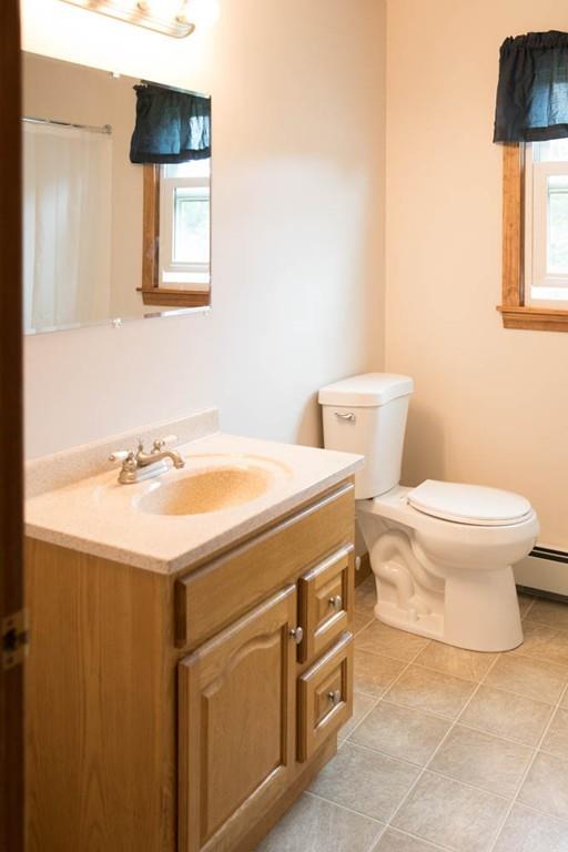 25 Fairview Road Wilbraham, MA 01095 - Photo 24 of 32 a bathroom with a sink a toilet and mirror