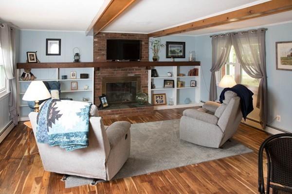 25 Fairview Road Wilbraham, MA 01095 - Photo 3 of 32 a living room with furniture a flat screen tv and a fireplace