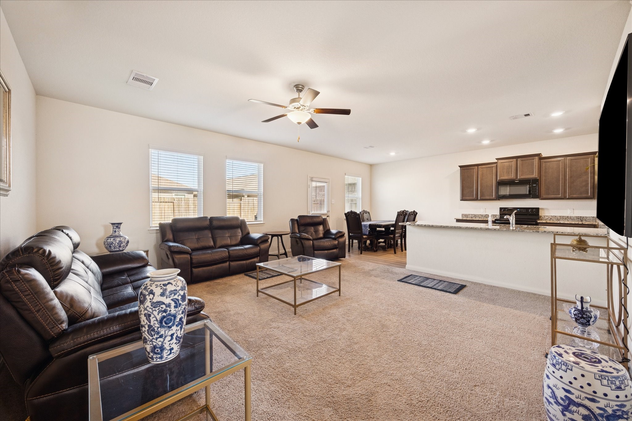 6215 El Turquesa Drive Houston, TX 77048 - Photo 4 of 16 a living room with furniture kitchen view and a chandelier