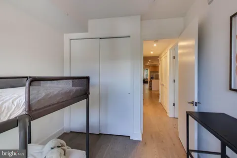 a view of a hallway and wooden floor