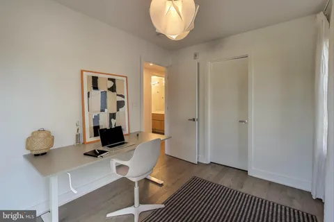 a view of a livingroom with furniture and a window