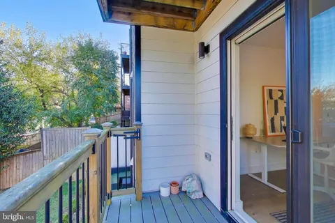 a view of balcony and wooden floor