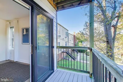 a view of a balcony with wooden floor