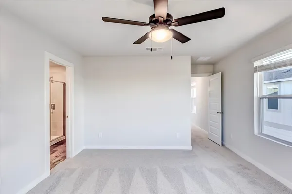 an empty room with fan