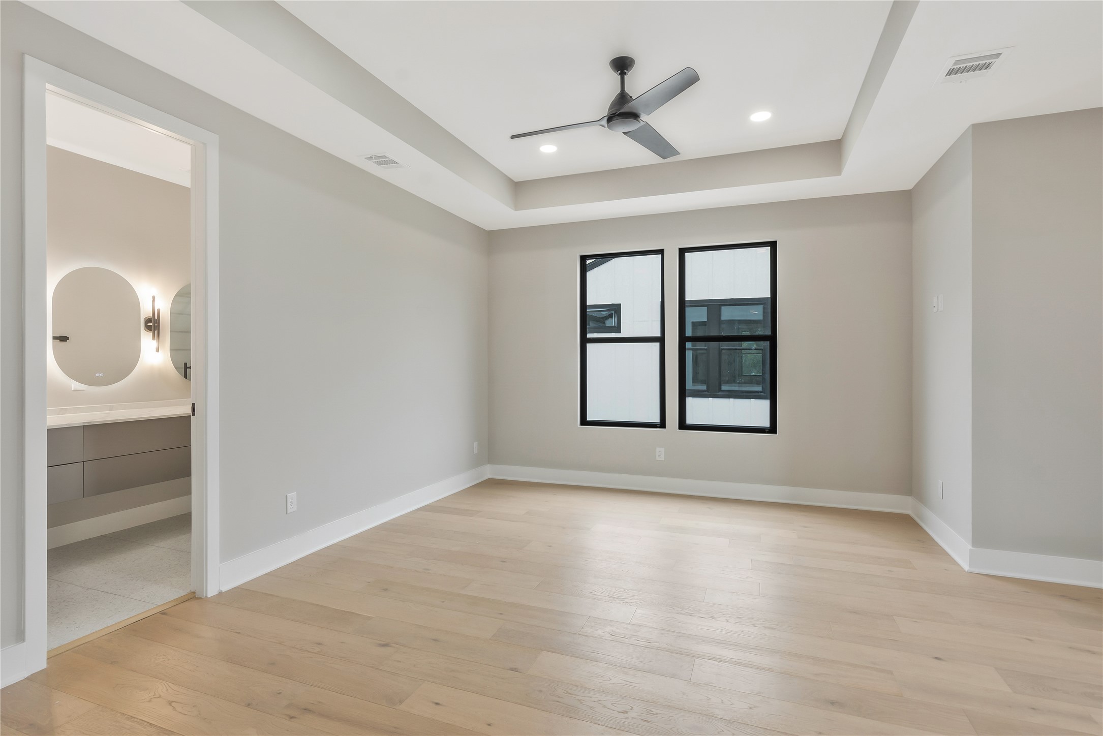 2237 Blalock Road Houston, TX 77080 - Photo 22 of 33 wooden floor in an empty room with a window