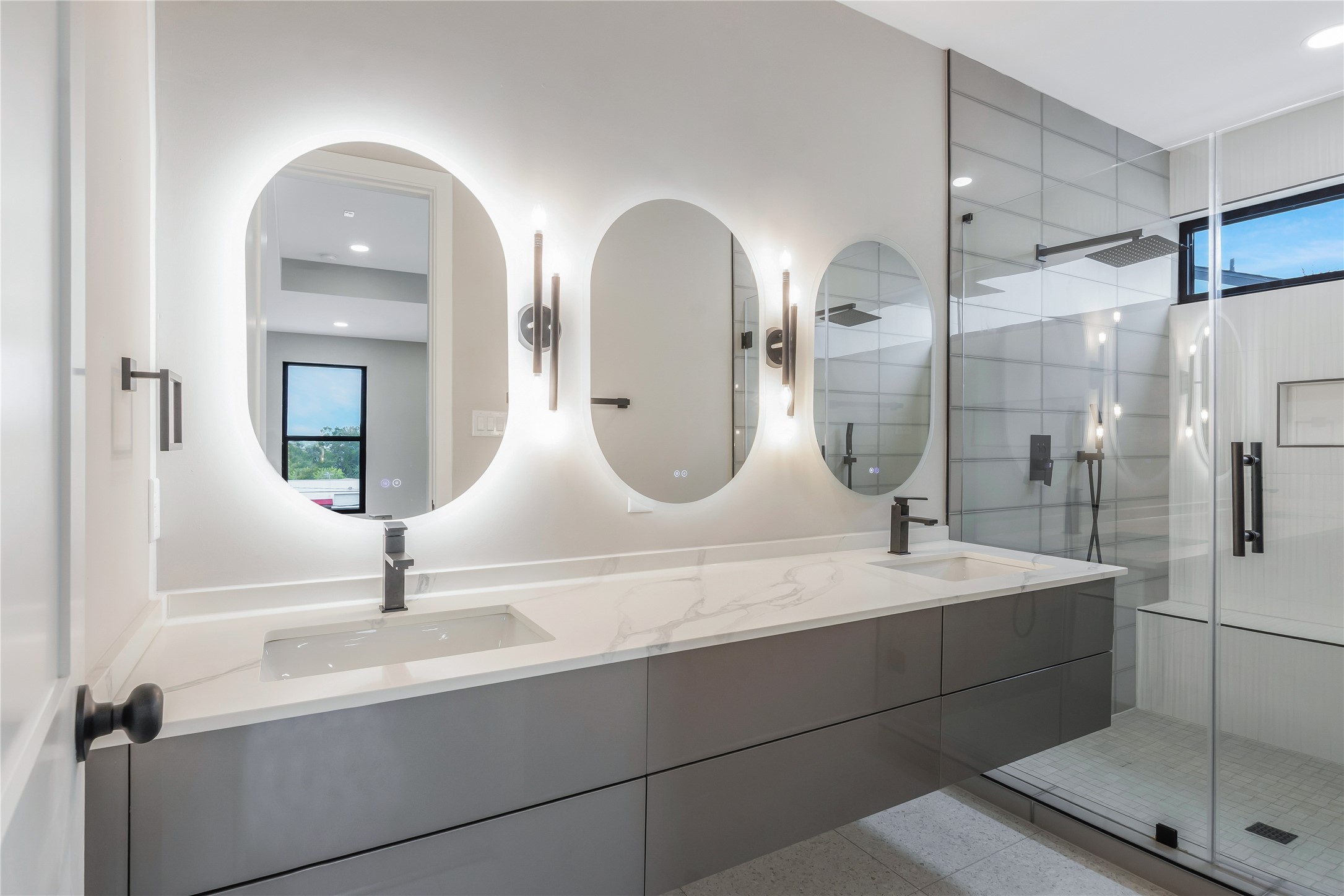 2237 Blalock Road Houston, TX 77080 - Photo 23 of 33 a bathroom with a double vanity sink and a mirror