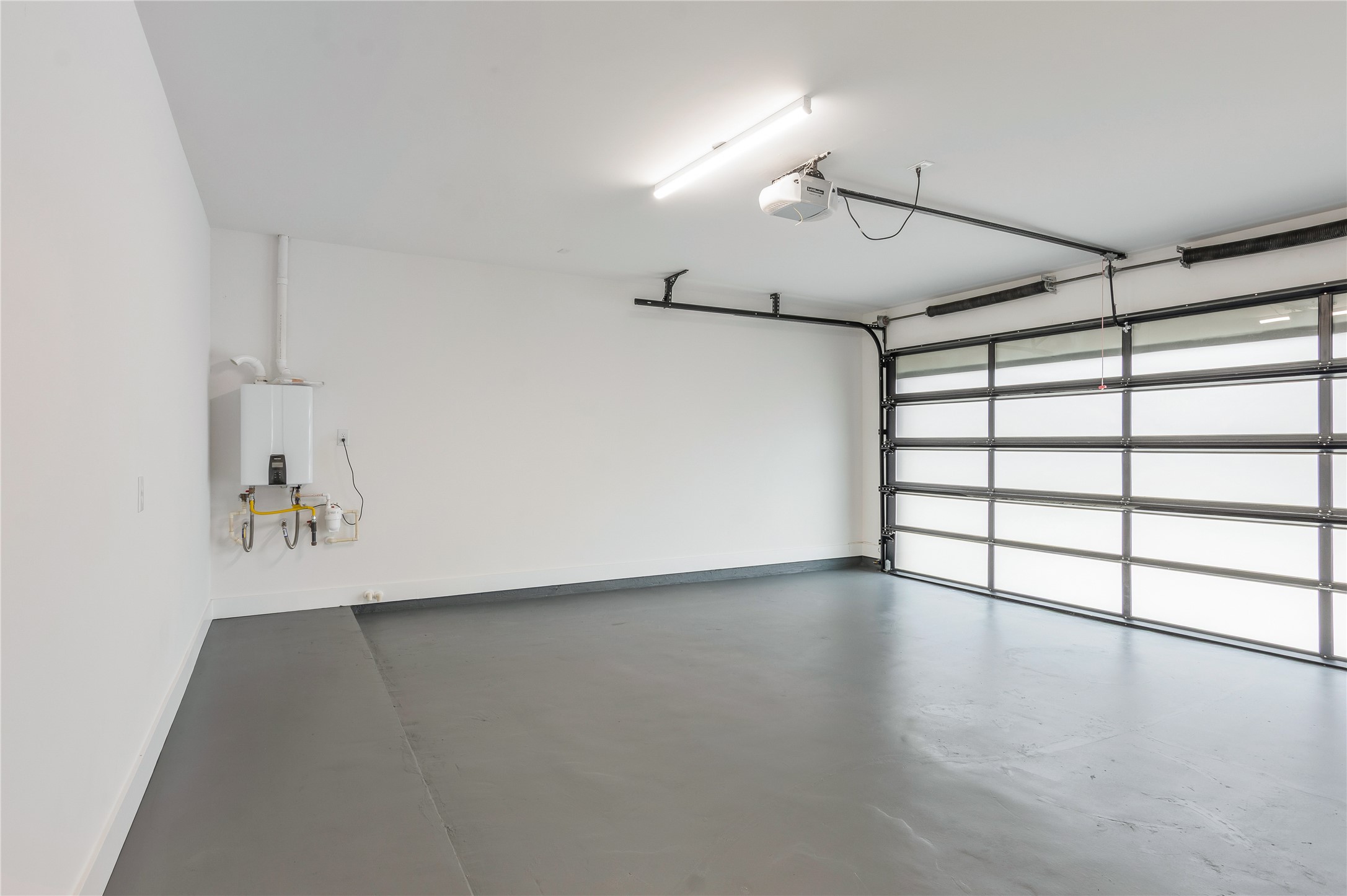 2237 Blalock Road Houston, TX 77080 - Photo 32 of 33 a view of an empty room with a window and wooden floor