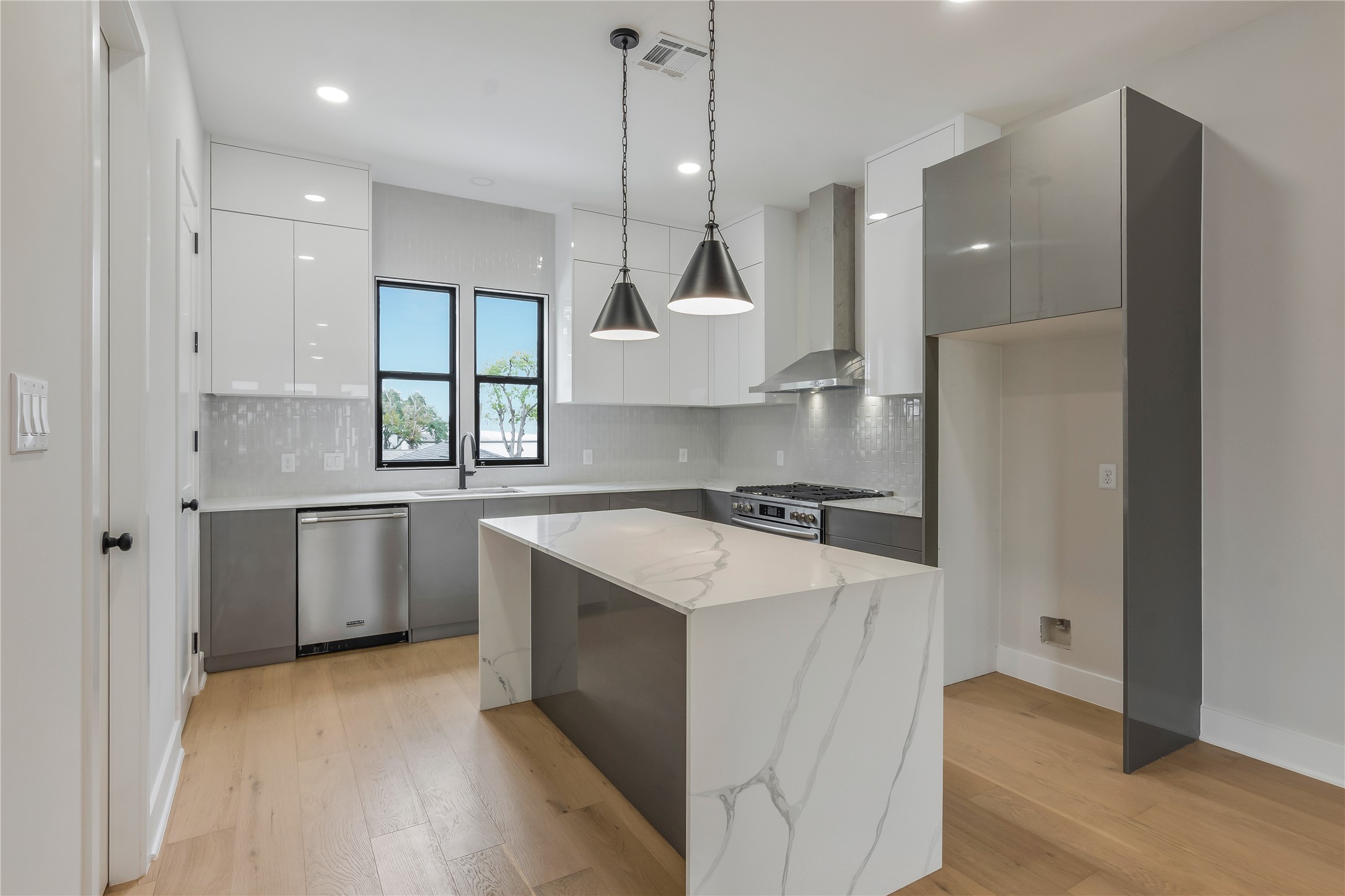 2237 Blalock Road Houston, TX 77080 - Photo 8 of 33 a kitchen with a stove a sink and a refrigerator