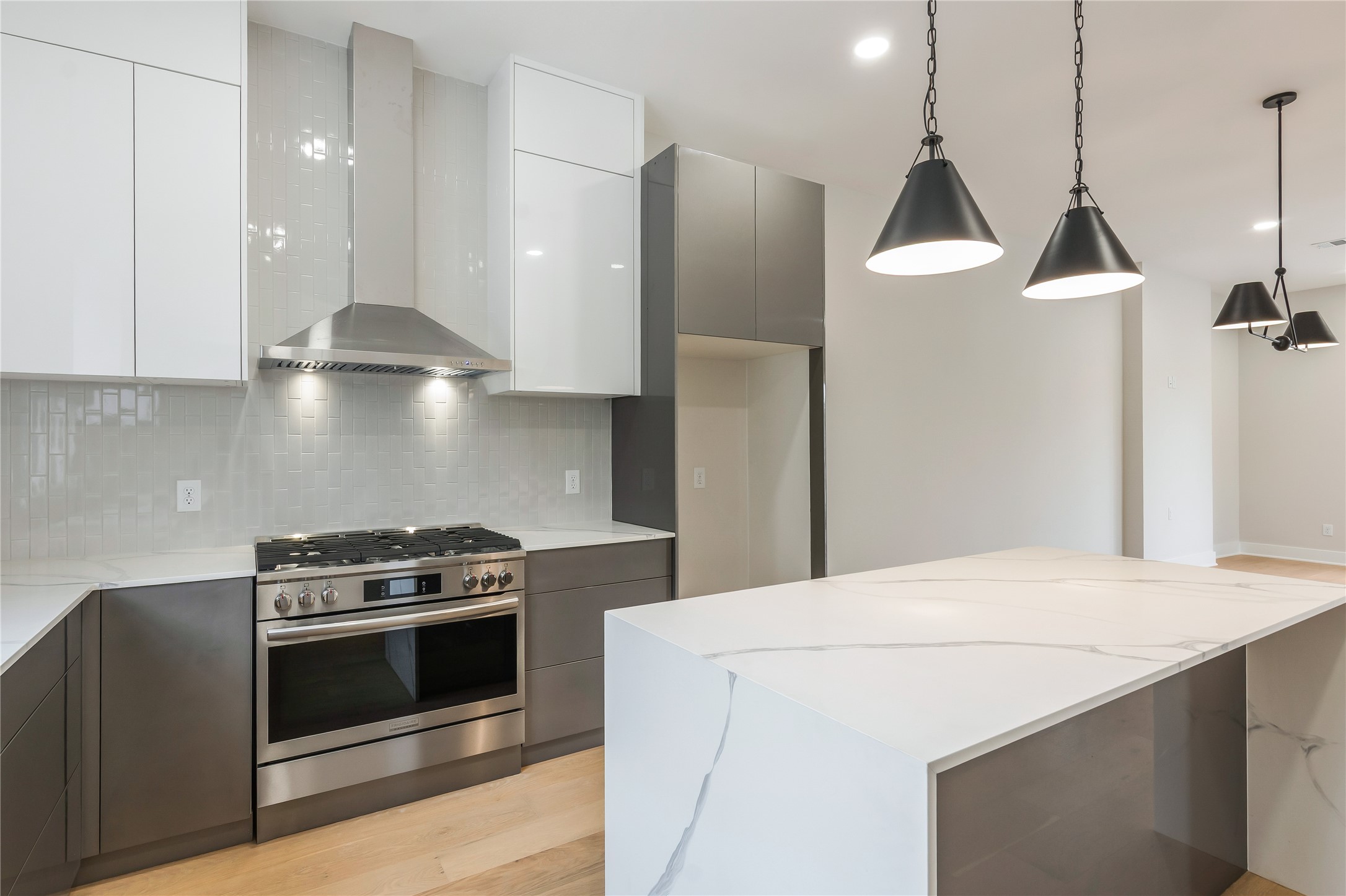 2237 Blalock Road Houston, TX 77080 - Photo 10 of 33 a kitchen with a stove and a refrigerator