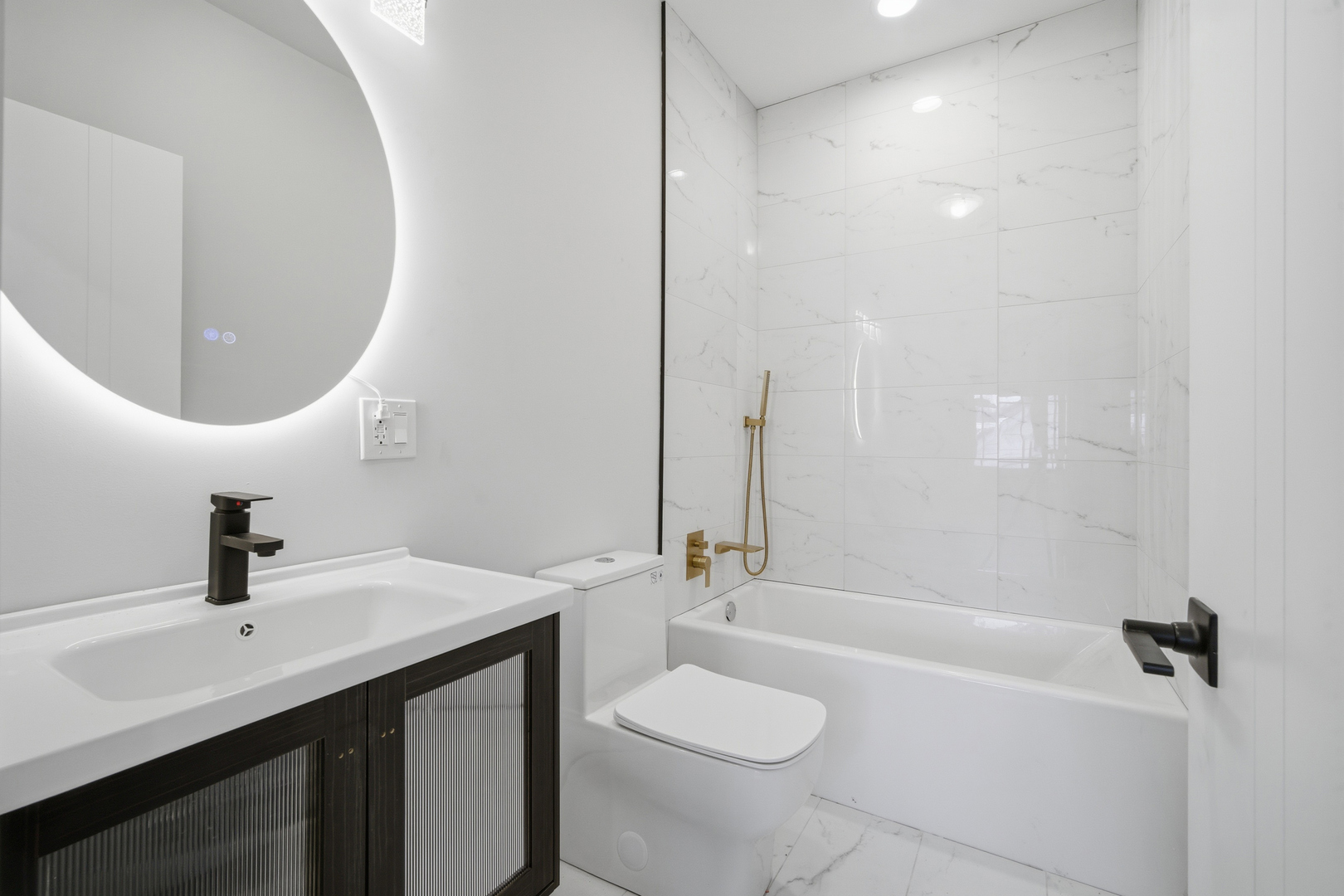 38 Washington Street Glenview, IL 60025 - Photo 16 of 27 a bathroom with a sink a toilet and shower