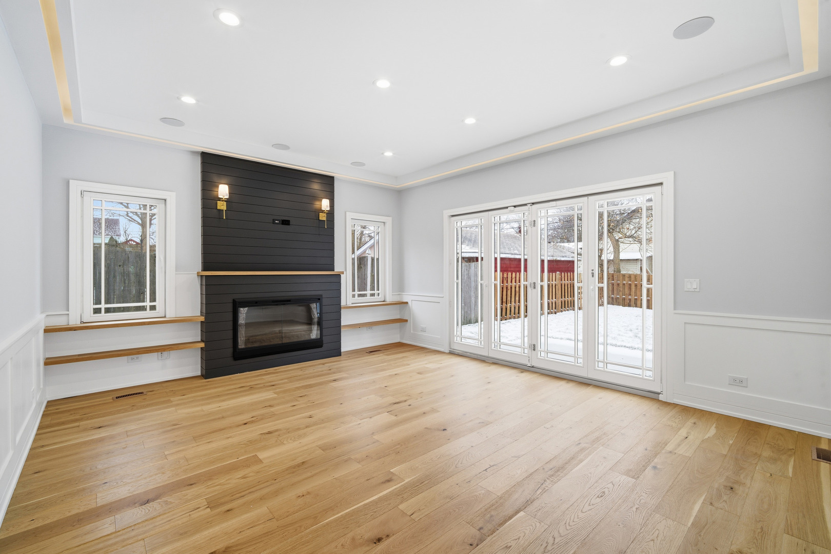 38 Washington Street Glenview, IL 60025 - Photo 2 of 27 a view of empty room with wooden floor and fireplace