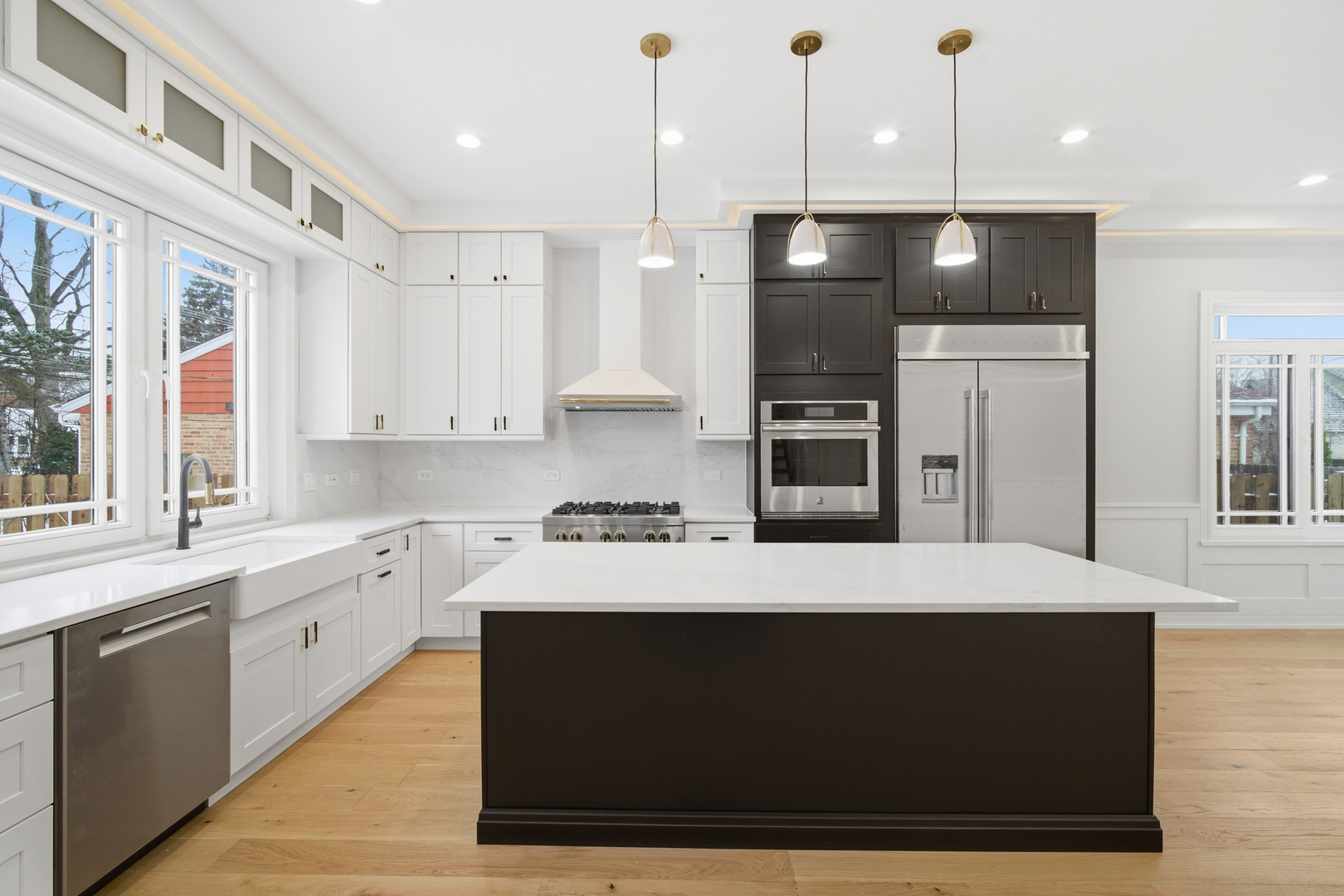 38 Washington Street Glenview, IL 60025 - Photo 7 of 27 a large kitchen with kitchen island a large counter top stainless steel appliances and cabinets