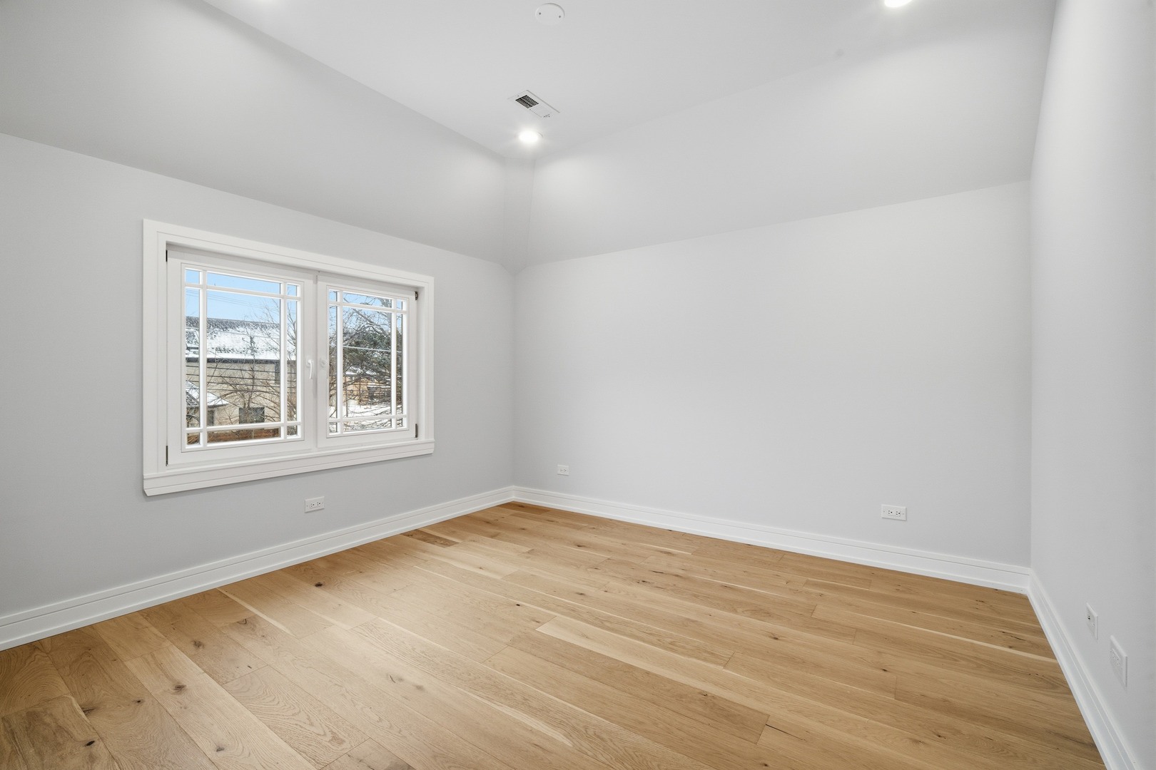 38 Washington Street Glenview, IL 60025 - Photo 9 of 27 wooden floor in an empty room with a window