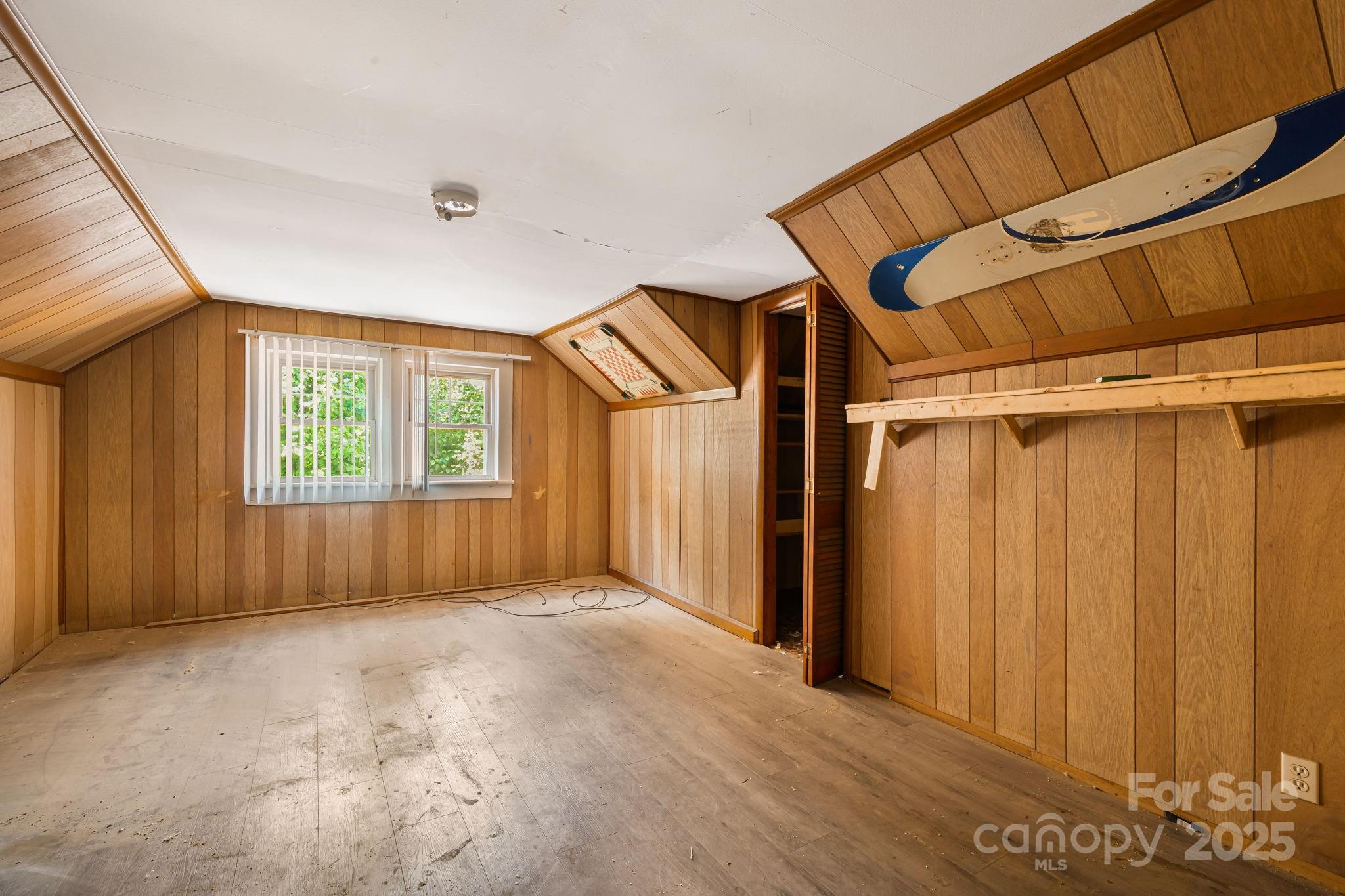 1277 Henson Cove Road Canton, NC 28716 - Photo 13 of 21 a view of an empty room with a window