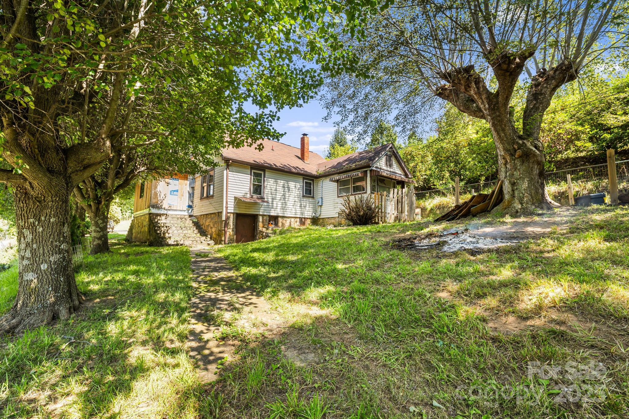 1277 Henson Cove Road Canton, NC 28716 - Photo 2 of 21 a front view of a house with a yard
