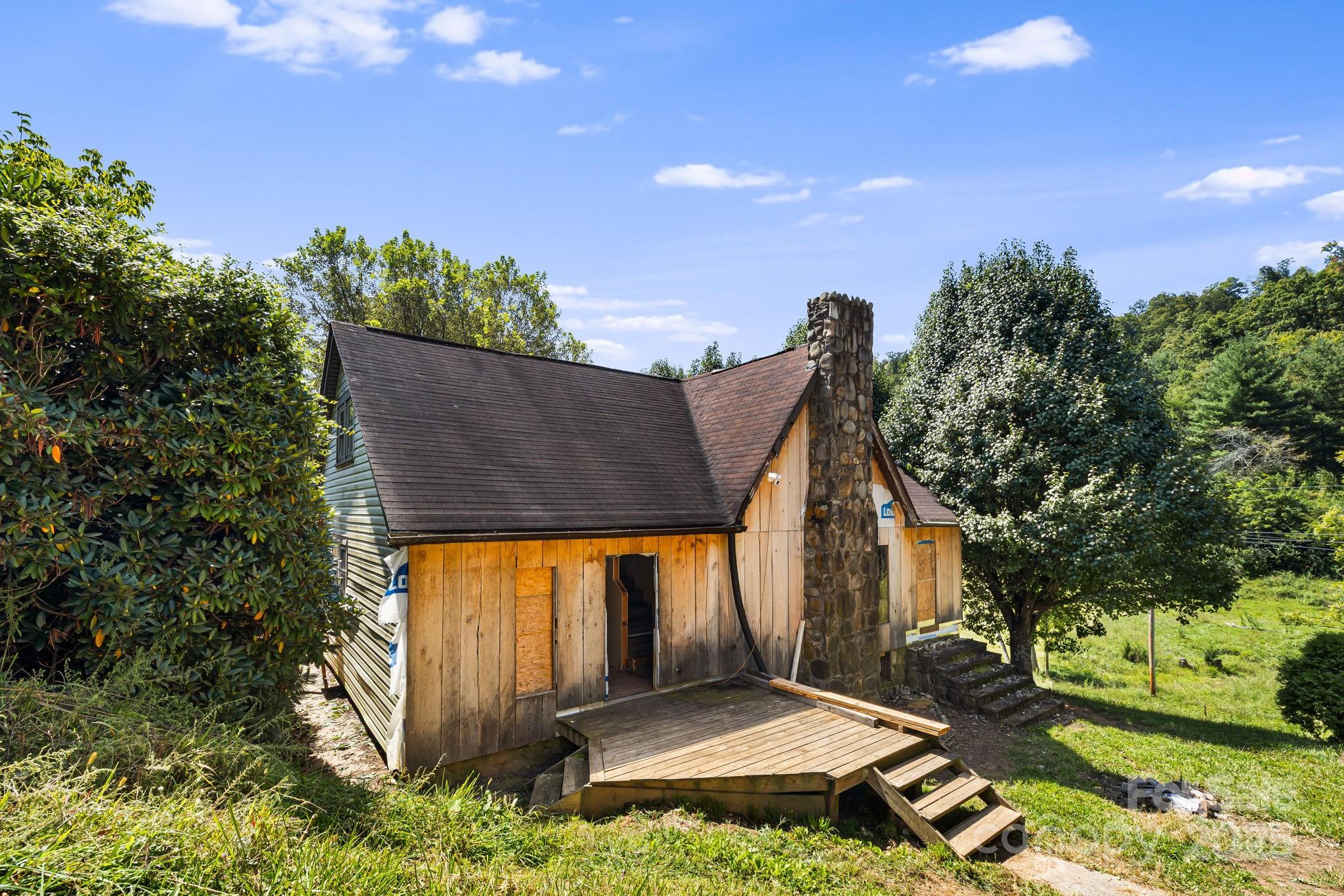 1277 Henson Cove Road Canton, NC 28716 - Photo 3 of 21 aerial view of a house with a yard
