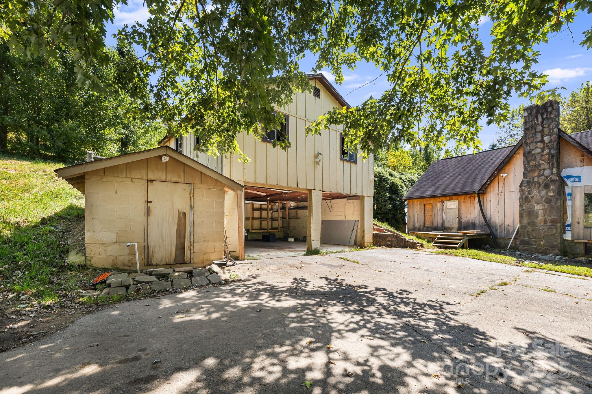 1277 Henson Cove Road Canton, NC 28716 - Photo 5 of 21 a front view of a house with a yard