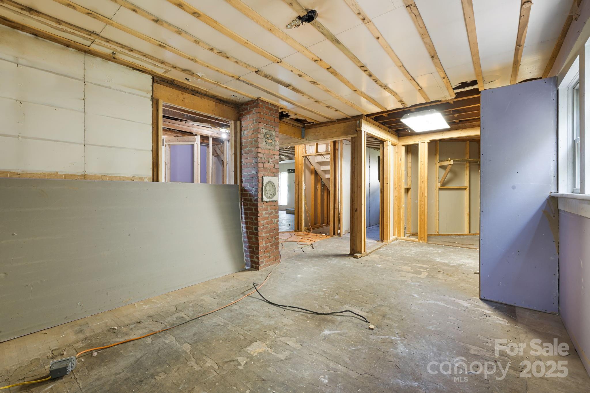 1277 Henson Cove Road Canton, NC 28716 - Photo 9 of 21 a view of empty room with wooden floor