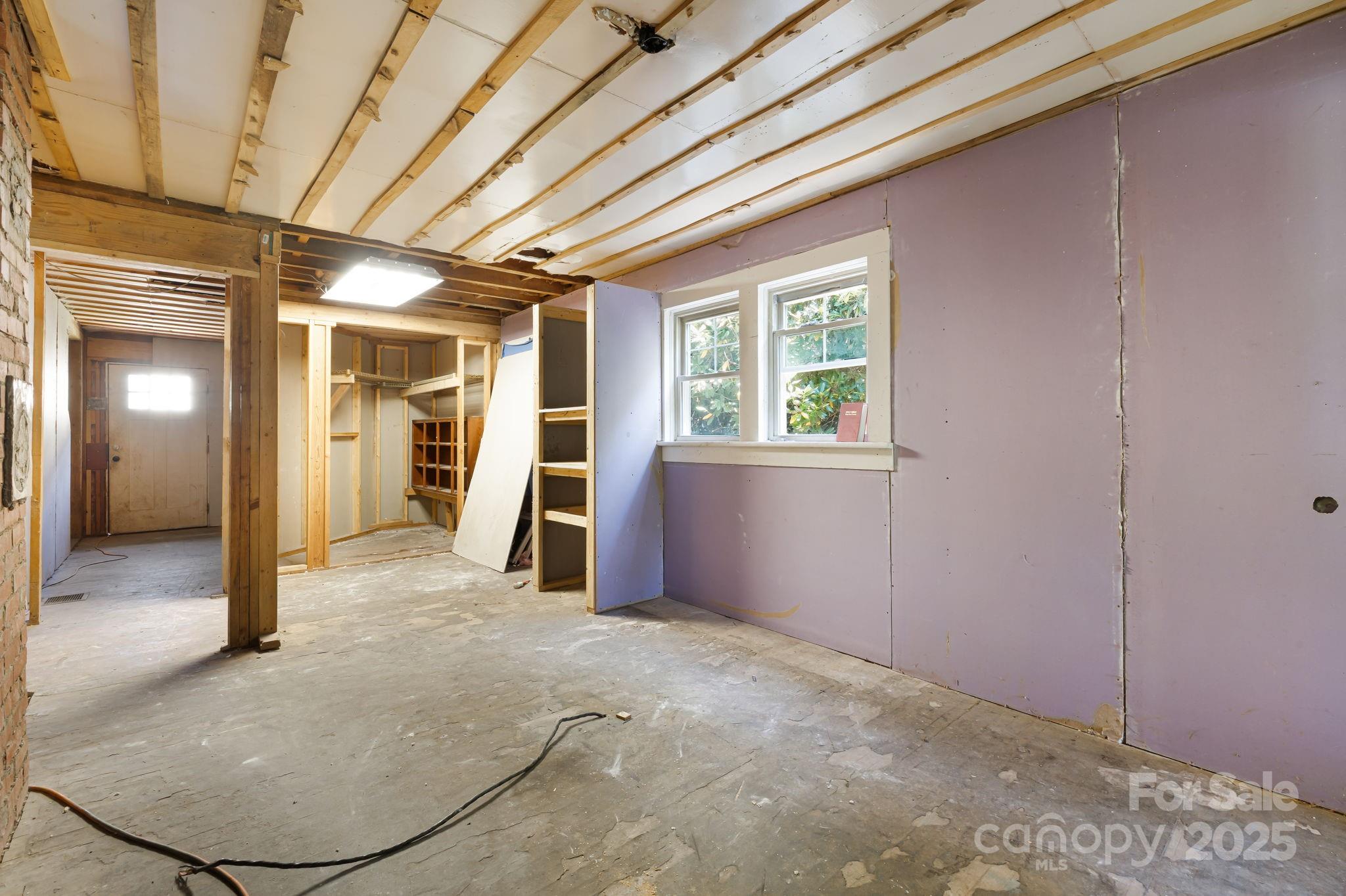 1277 Henson Cove Road Canton, NC 28716 - Photo 10 of 21 wooden floor and windows in an empty room
