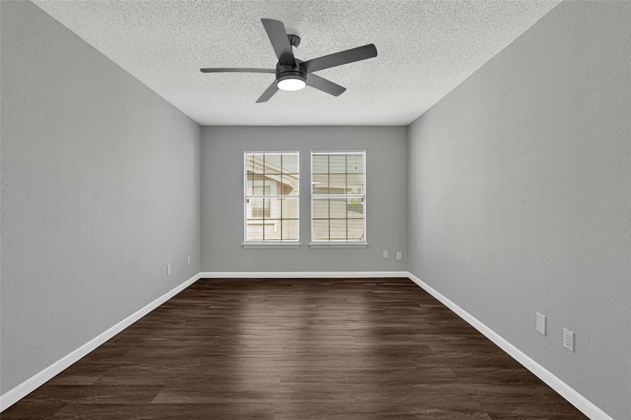 12111 Lemon Ridge Lane, Unit 121 Houston, TX 77035 - Photo 8 of 25 a view of empty room with wooden floor and fan