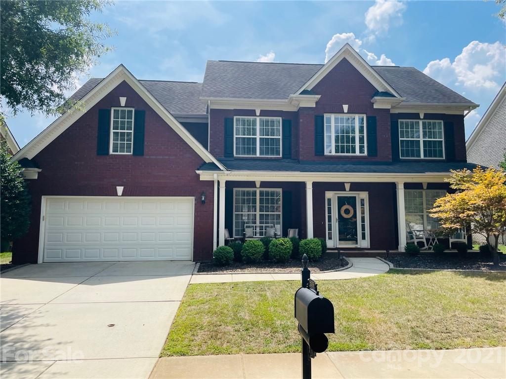6008 Colton Ridge Drive Indian Trail, NC 28079 - Photo 1 of 14 a front view of a house with a yard