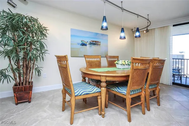 a dining room with furniture and window