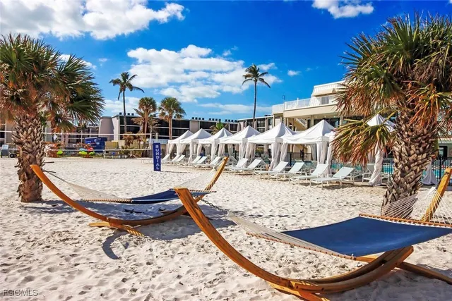 a view of swimming pool with outdoor seating