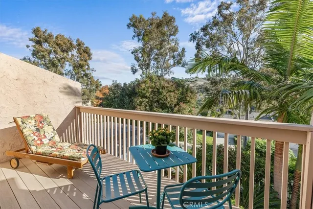 a view of a balcony with chairs