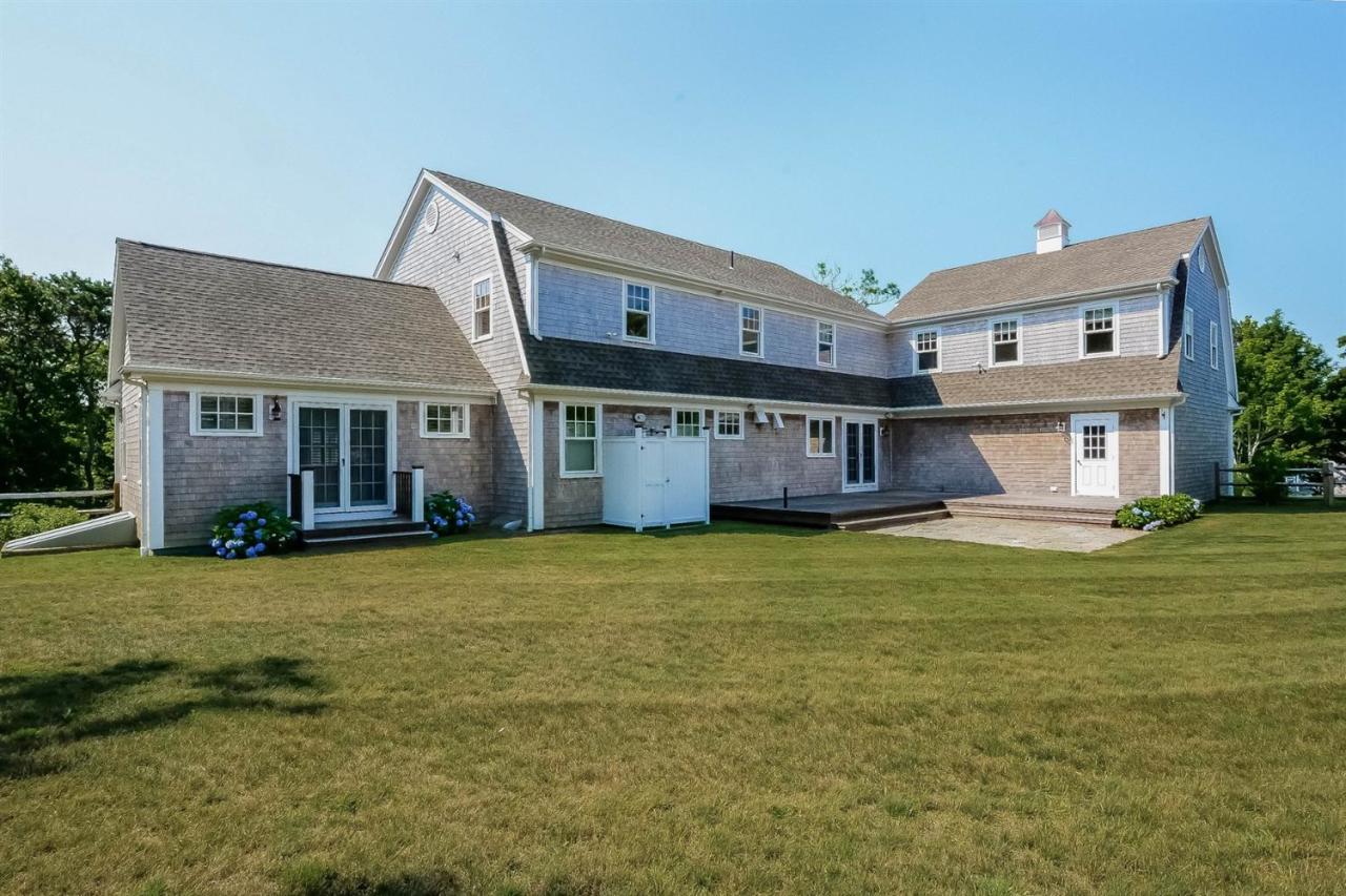 56 Sears Road Chatham, MA 02633 - Photo 14 of 14 a front view of a house with a garden