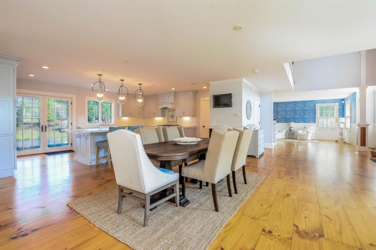 56 Sears Road Chatham, MA 02633 - Photo 6 of 14 a living room with dining room and wooden floor