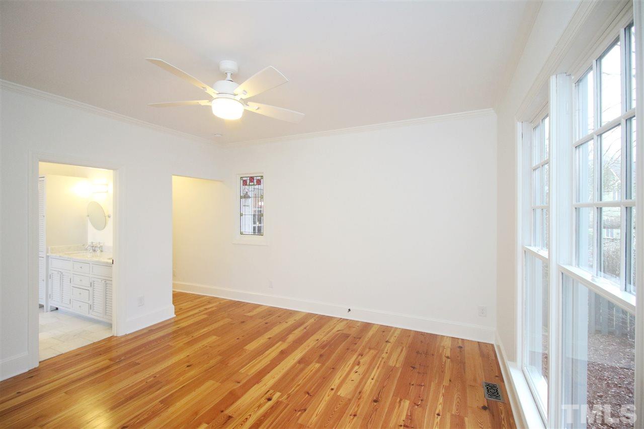 407 Polk Street Raleigh, NC 27604 - Photo 13 of 25 a view of empty room with wooden floor and fan