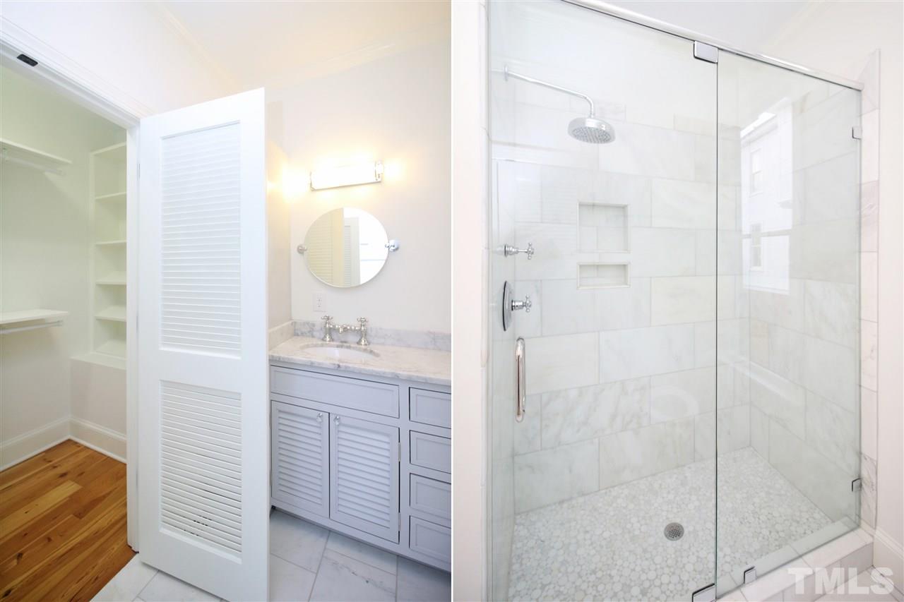 407 Polk Street Raleigh, NC 27604 - Photo 15 of 25 a bathroom with a shower sink and mirror
