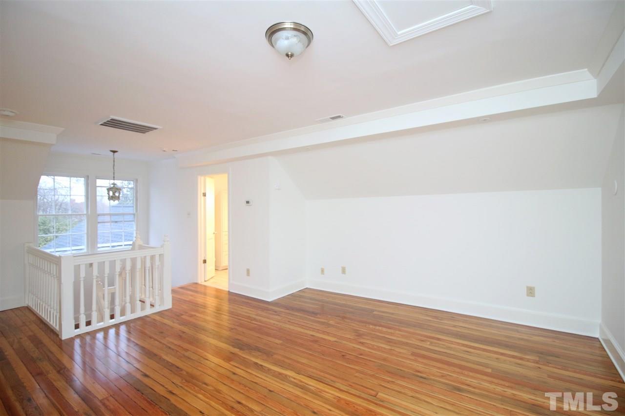 407 Polk Street Raleigh, NC 27604 - Photo 17 of 25 wooden floor in an empty room with a window