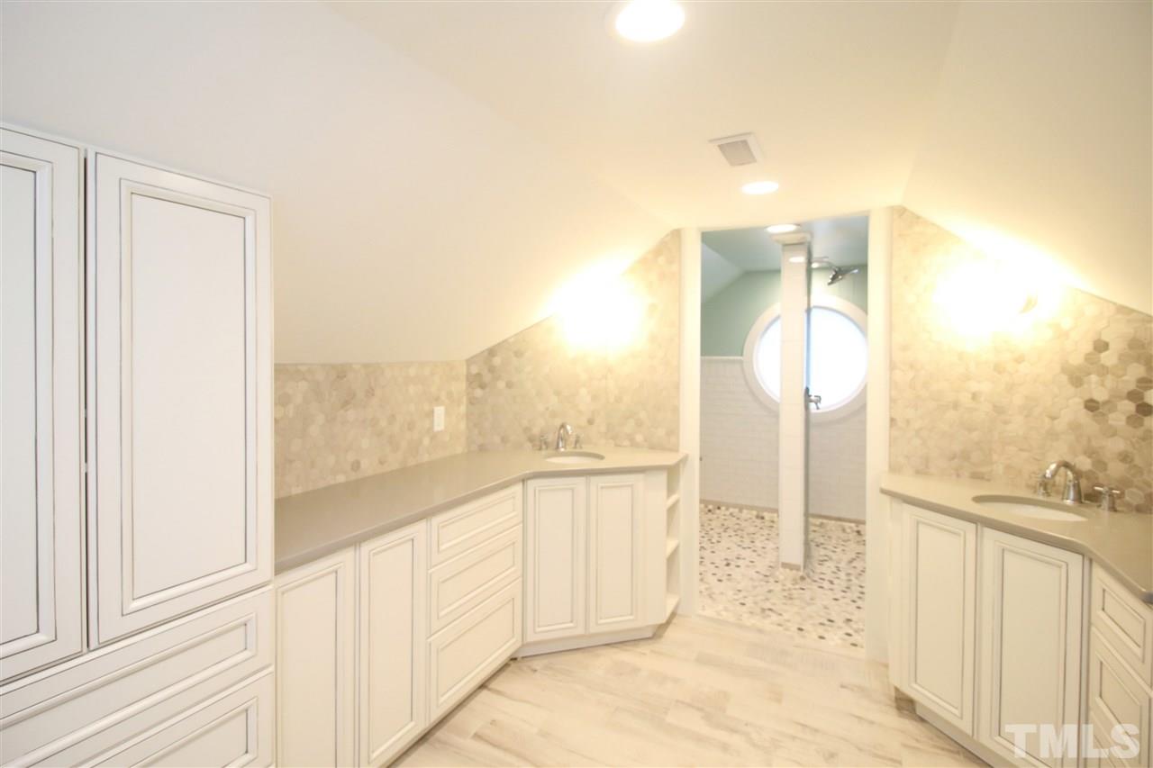 407 Polk Street Raleigh, NC 27604 - Photo 19 of 25 a view of a bathroom with a sink