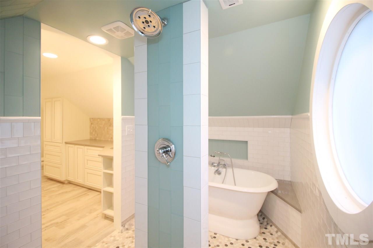 407 Polk Street Raleigh, NC 27604 - Photo 22 of 25 a bathroom with a sink a toilet and shower